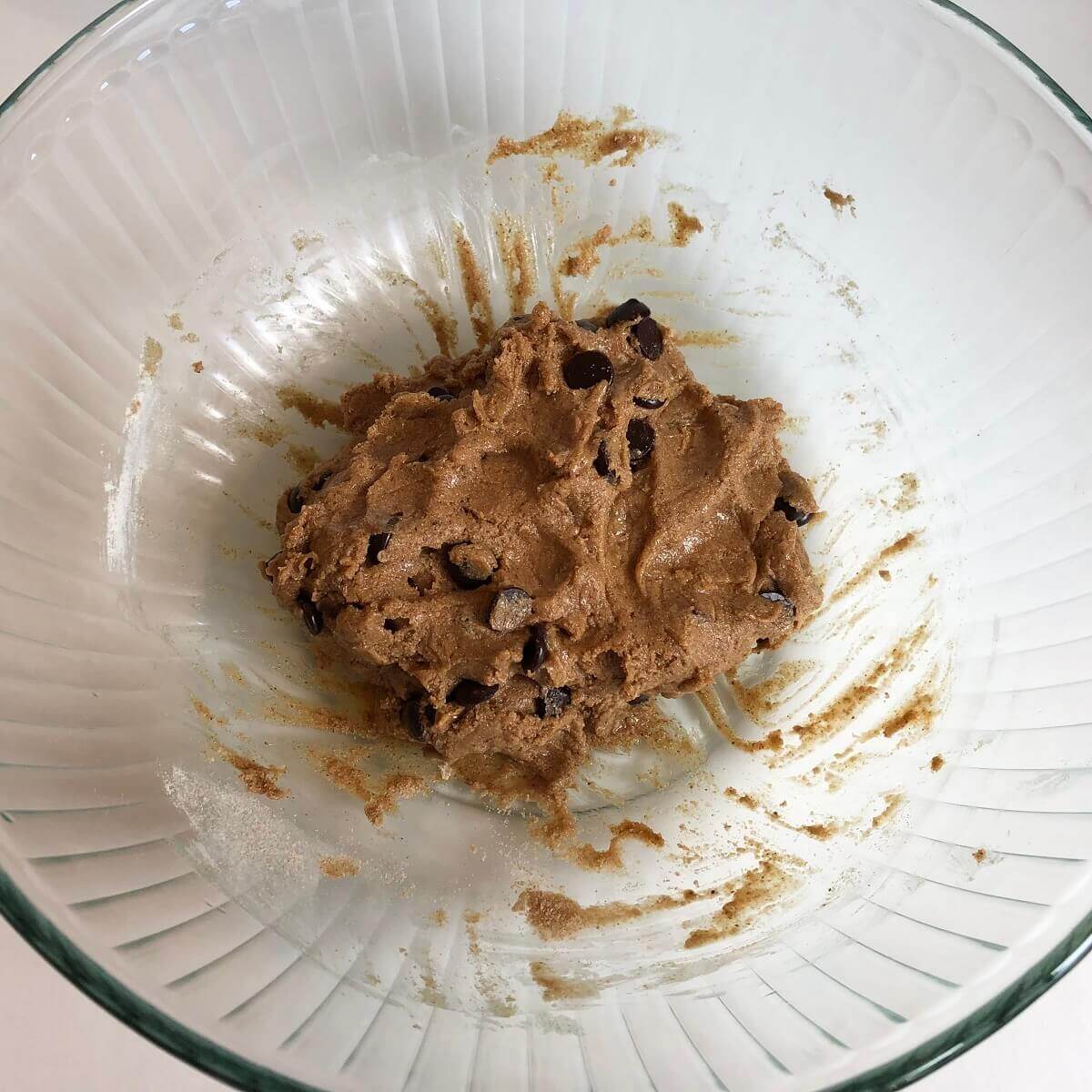 Maple cookie dough in a glass bowl.