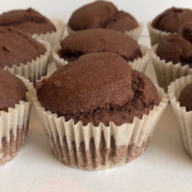 Nine cupcakes lined up neatly in rows.