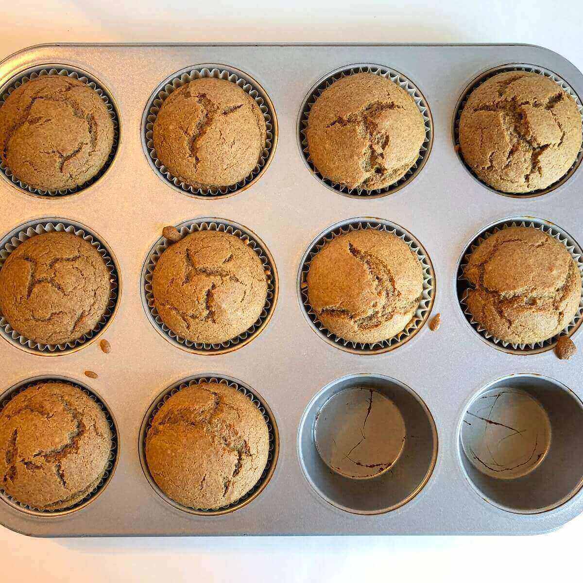 Ten muffins in a baking pan.