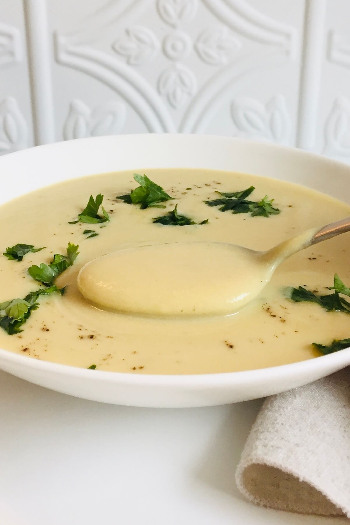 Creamy soup in a white bowl.