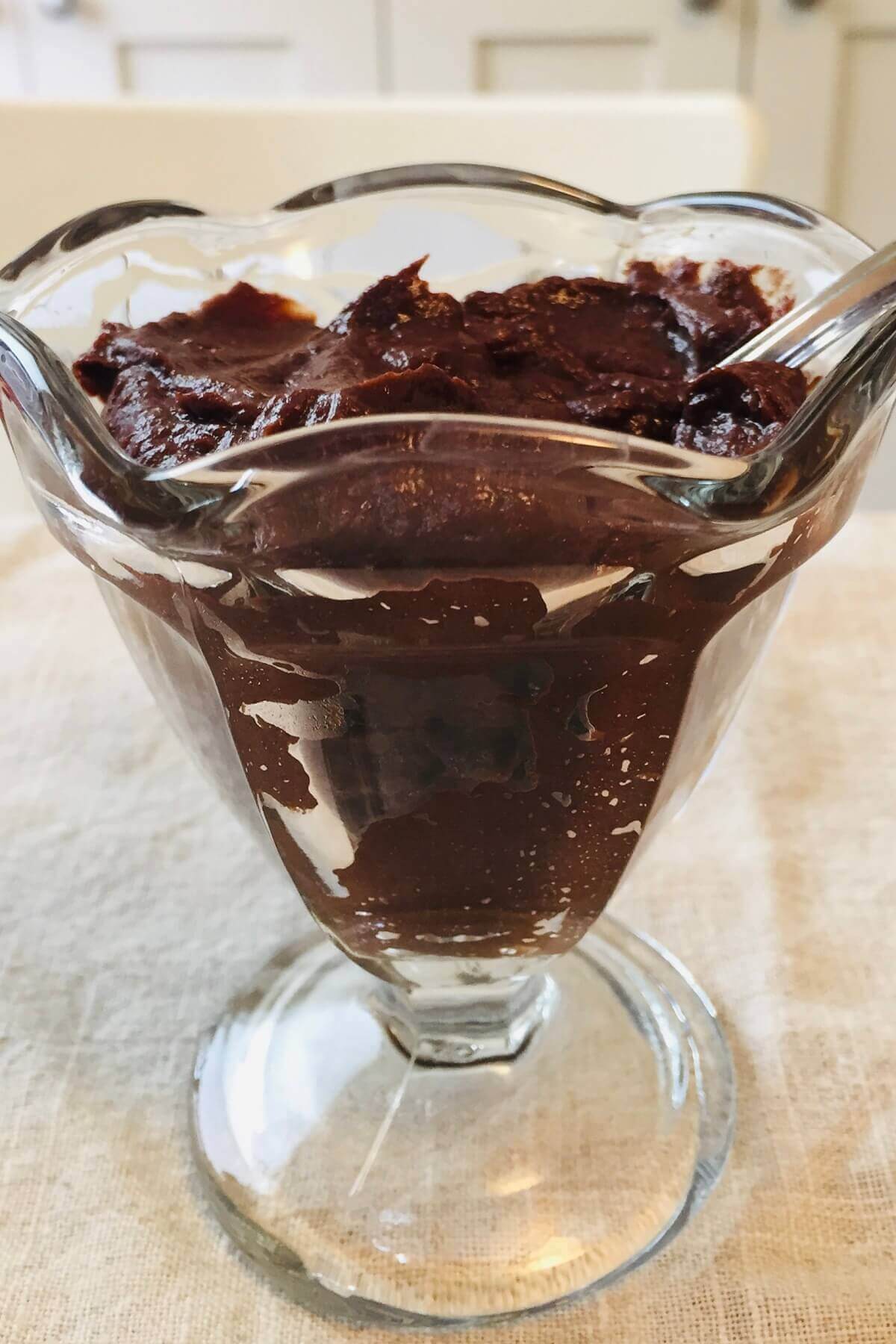 Pudding in a glass sundae dish.