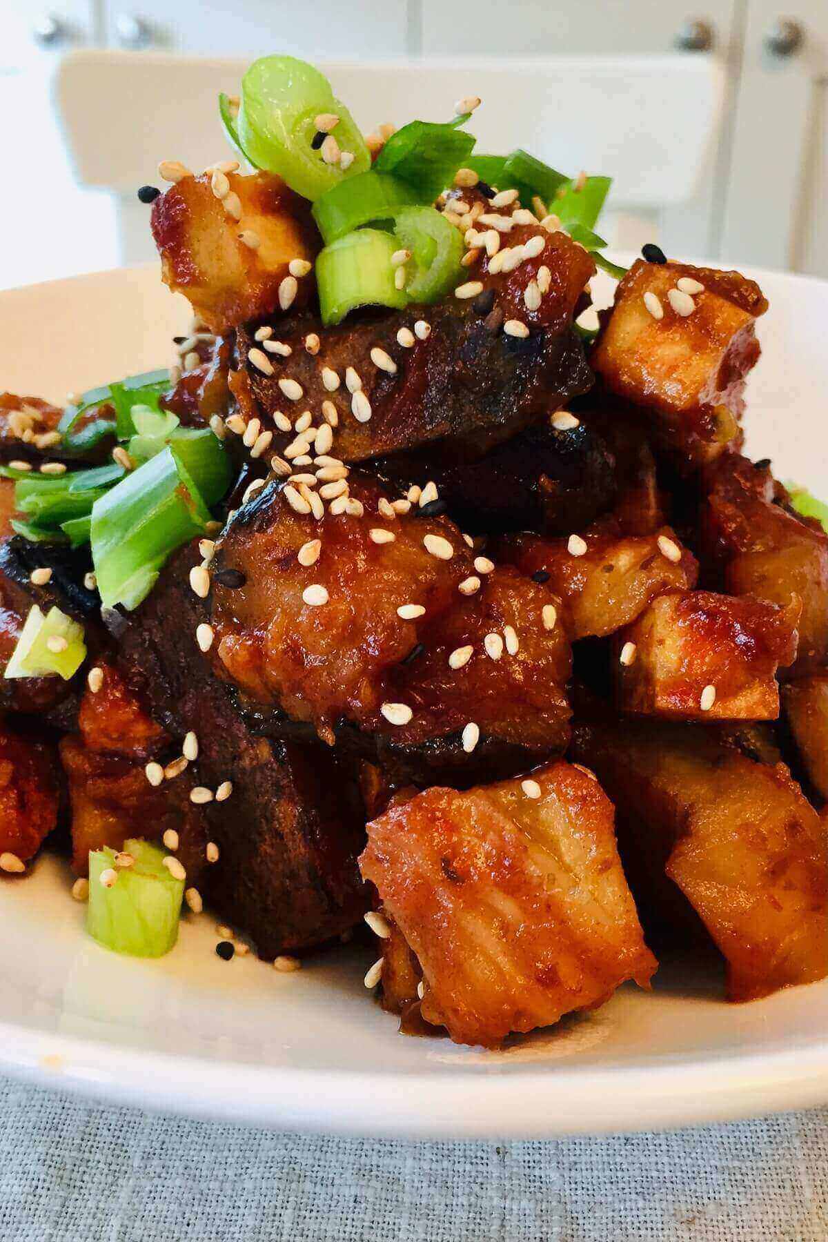 Tofu chunks in a white bowl.