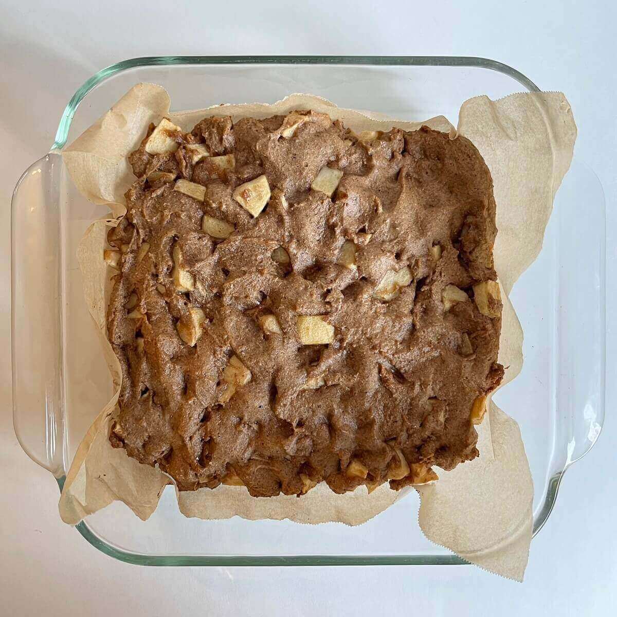 Freshly baked bars in a glass baking pan.