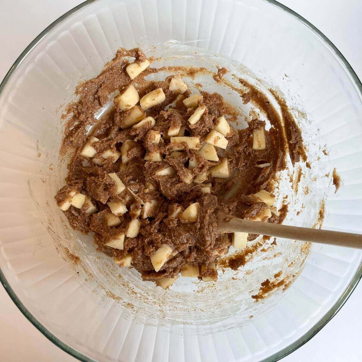 Batter for apple squares in a large glass bowl.