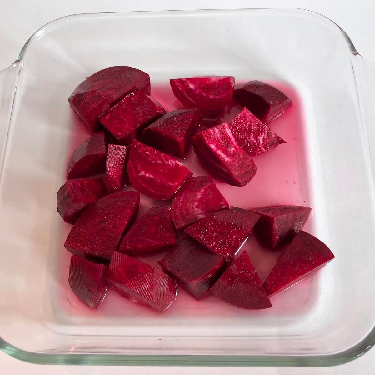 Chopped beets in a glass dish.