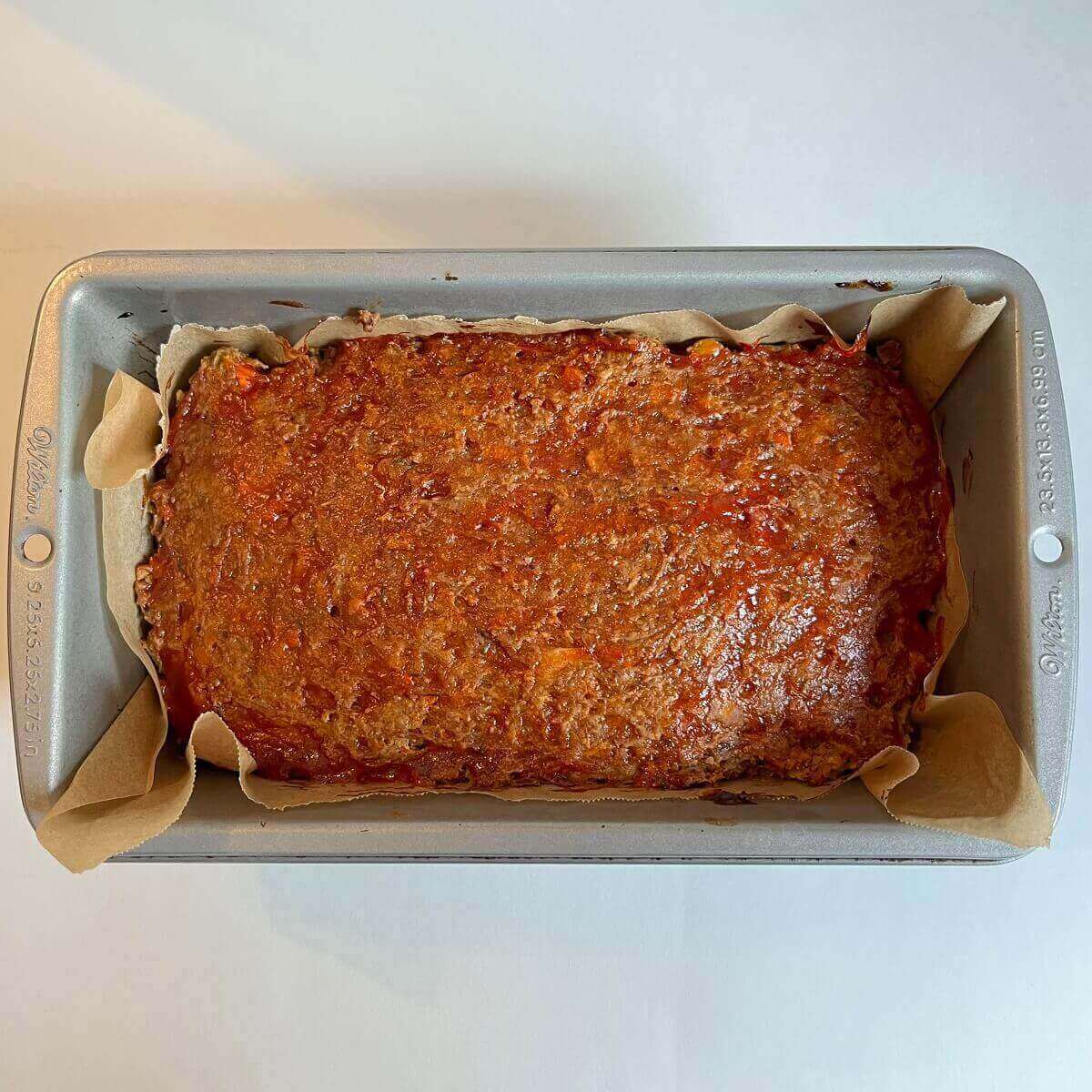 Meatloaf in a metal pan.