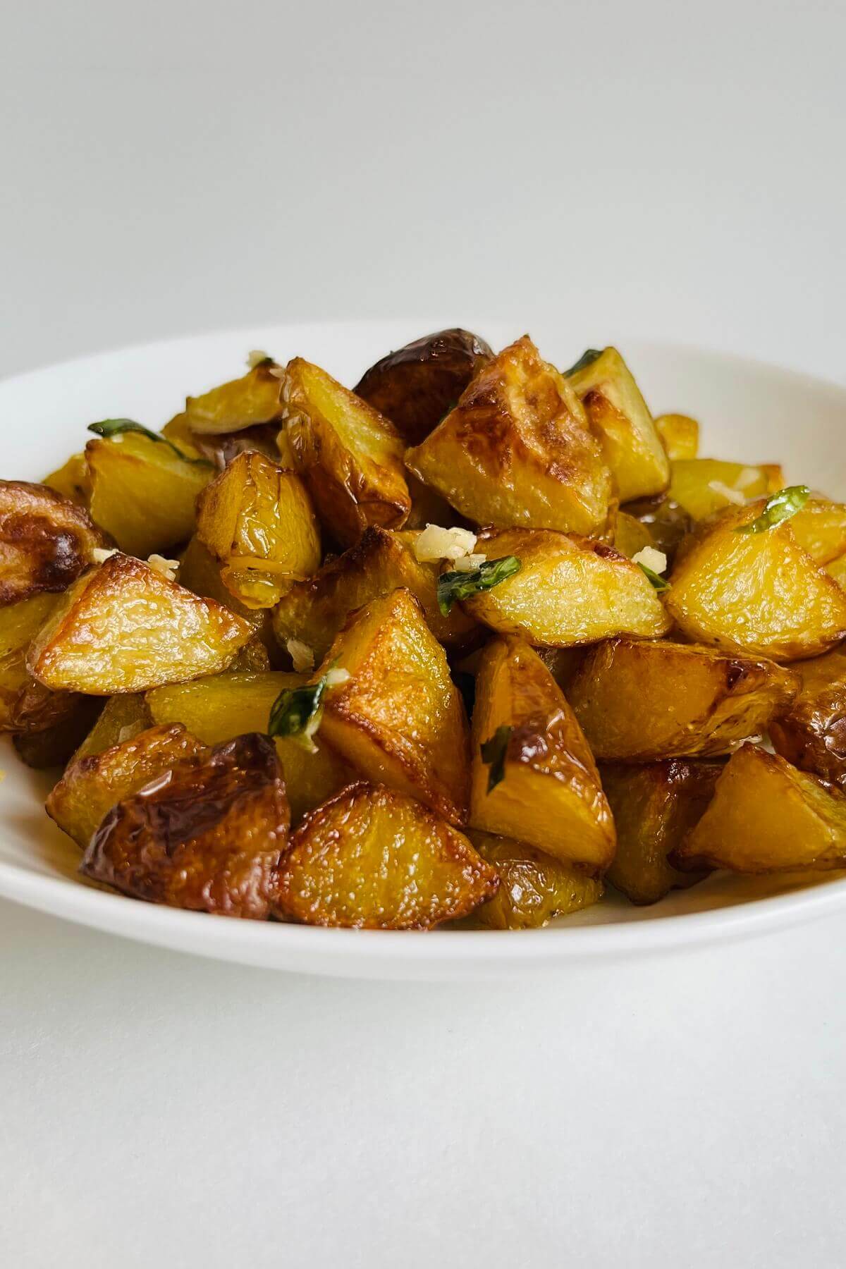 Roasted potatoes in a bowl.