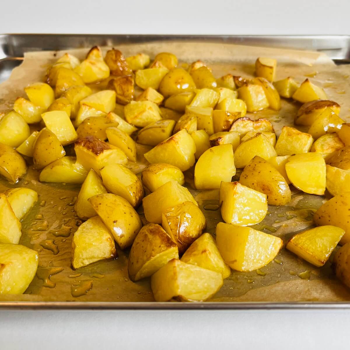 Roasted potatoes on a sheet pan.