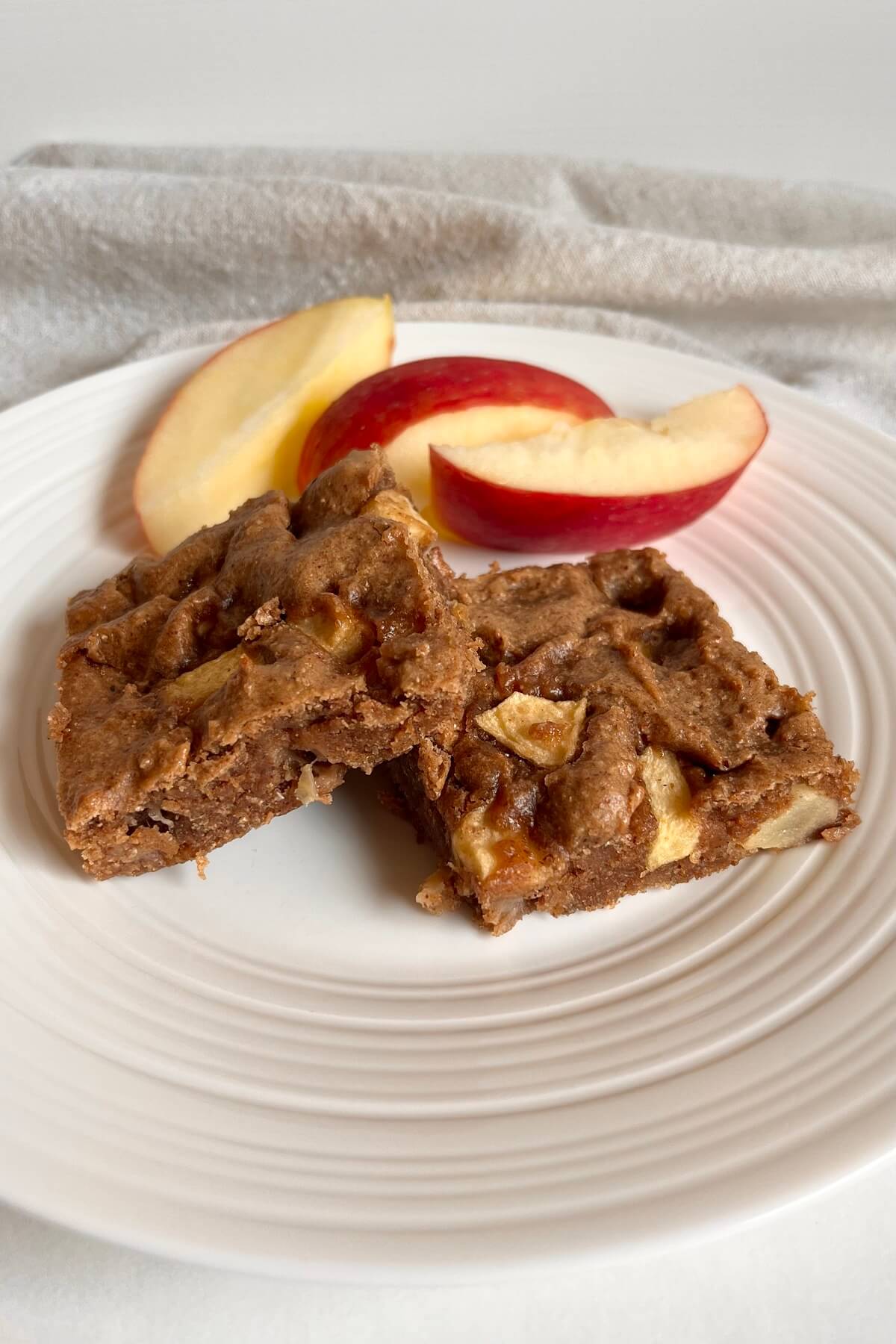 Apple squares on a white plate.