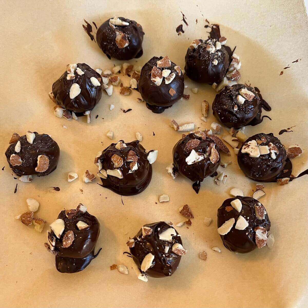 Chocolates on a piece of parchment paper.