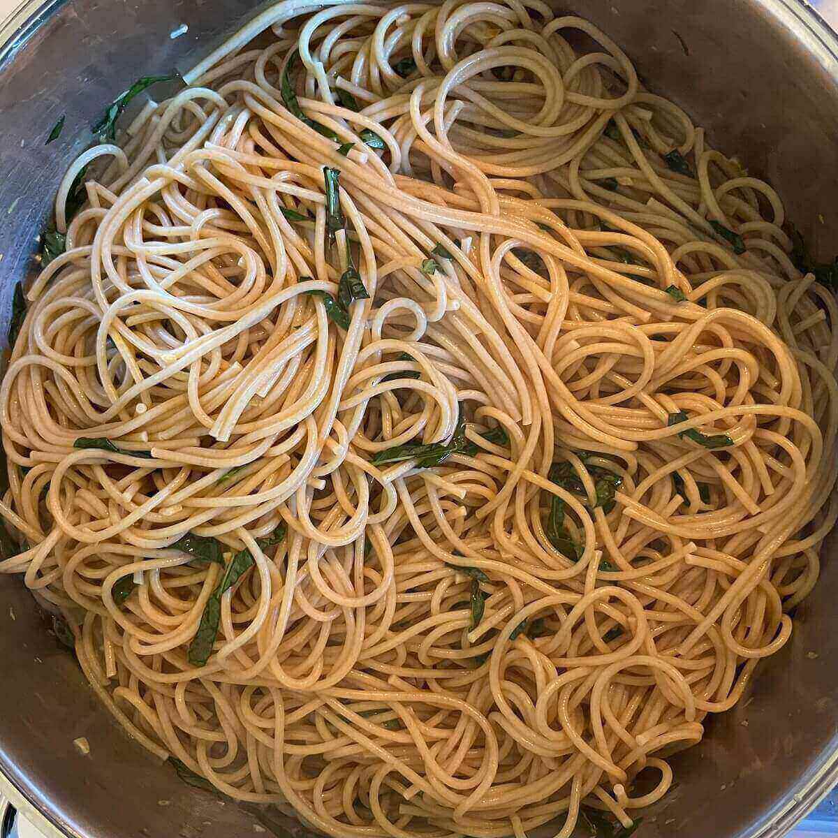 Pasta in a large metal pot.