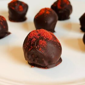 Chocolates on a white plate.