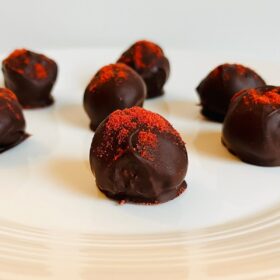 Strawberry truffles sprinkled with freeze-dried strawberry powder.