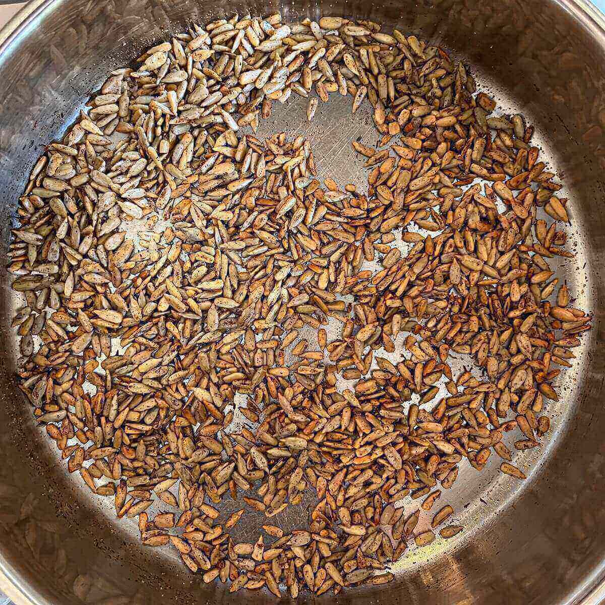 Toasted sunflower seeds in a pan.