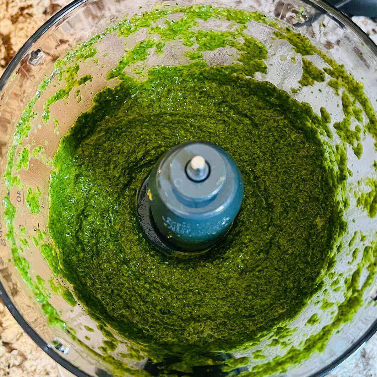 Green sauce in a food processor.