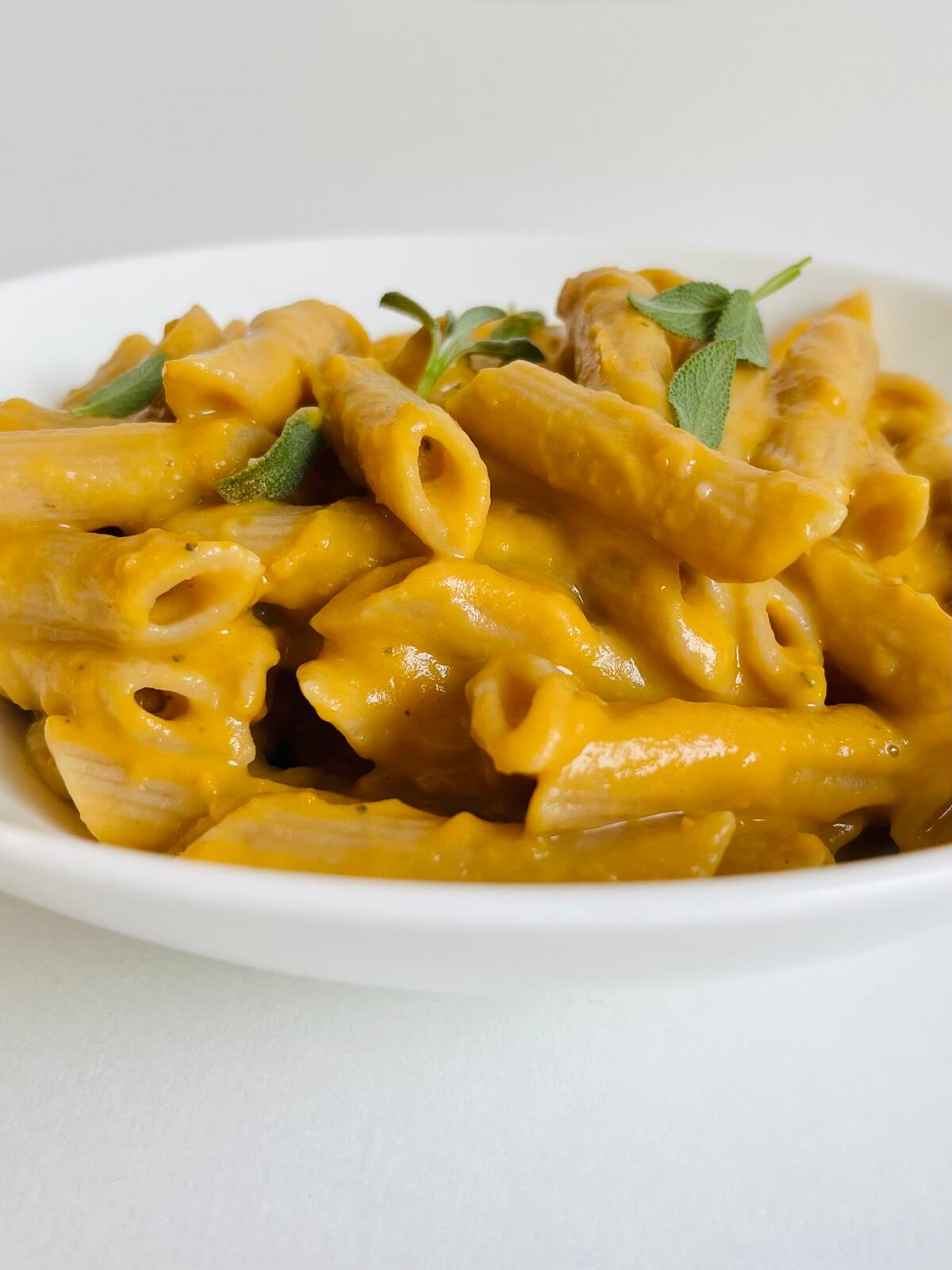 A bowl full of sweet potato pasta.