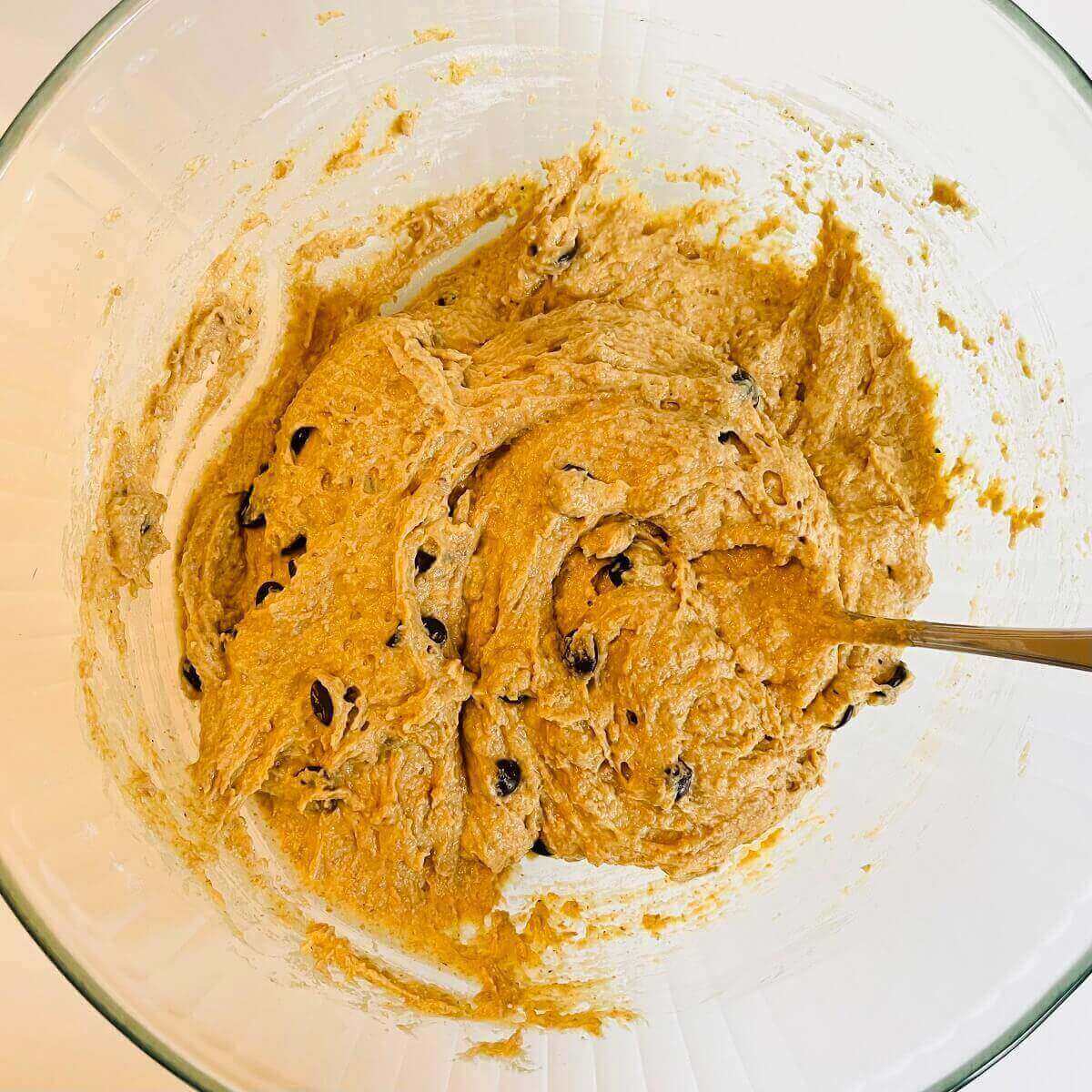 Raw vegan muffin batter in a glass bowl.
