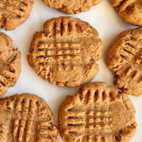 Peanut butter cookies on a white plate.