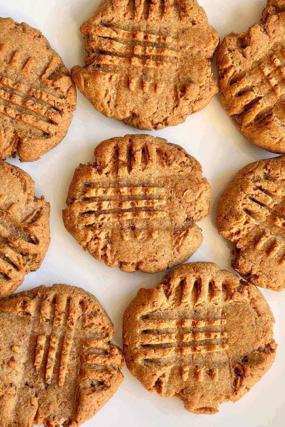 Eight cookies on a white plate.