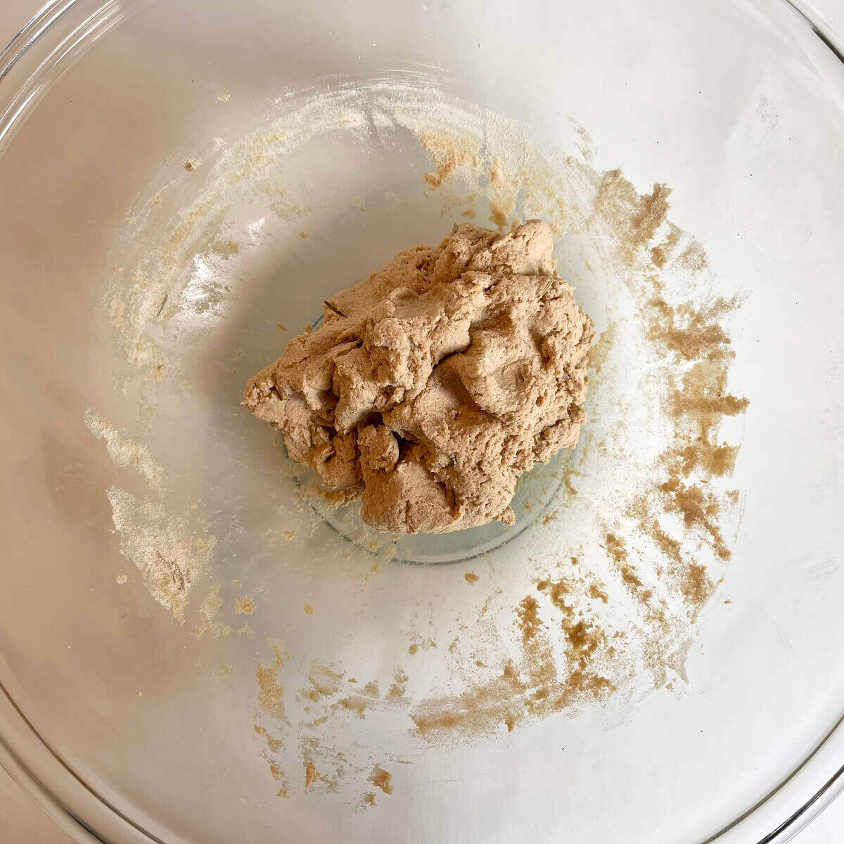 Raw amaranth dough in a glass mixing bowl.
