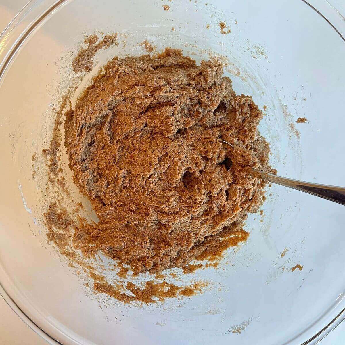 Spelt batter in a glass bowl.