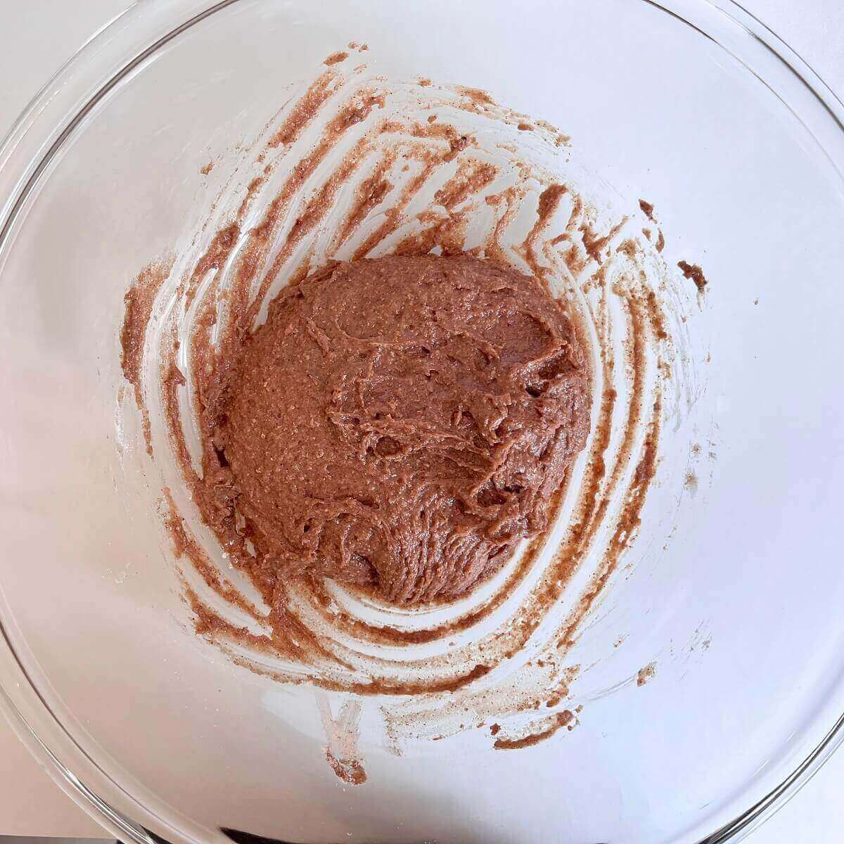 Strawberry cookie dough in a glass mixing bowl.