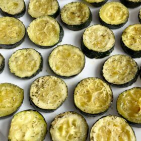 Round slices of zucchini on a plate.