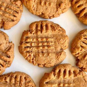 Light brown cookies on a white plate.