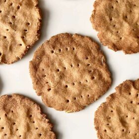 Gluten-free crackers on a white plate.