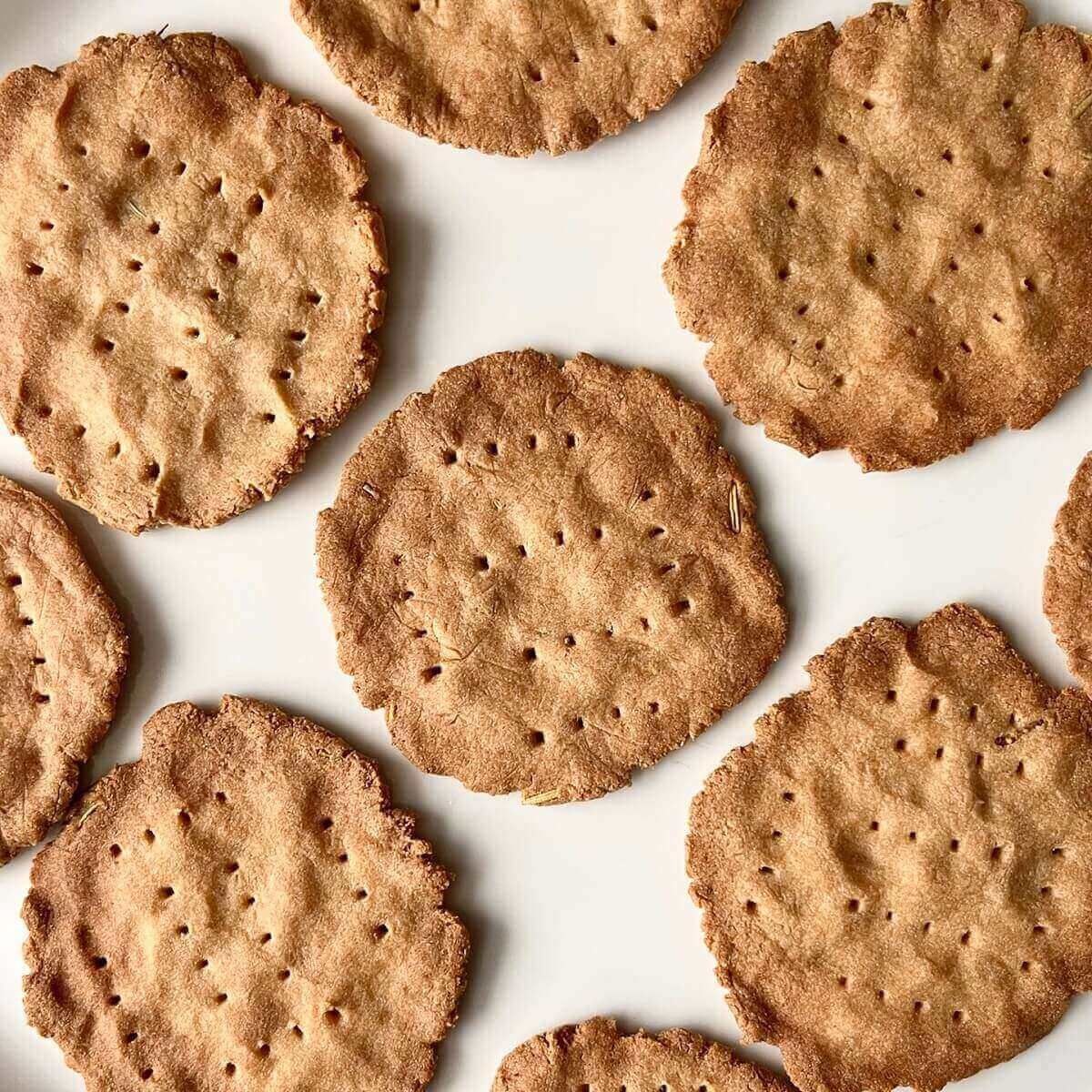 Gluten free vegan crackers on a white plate.