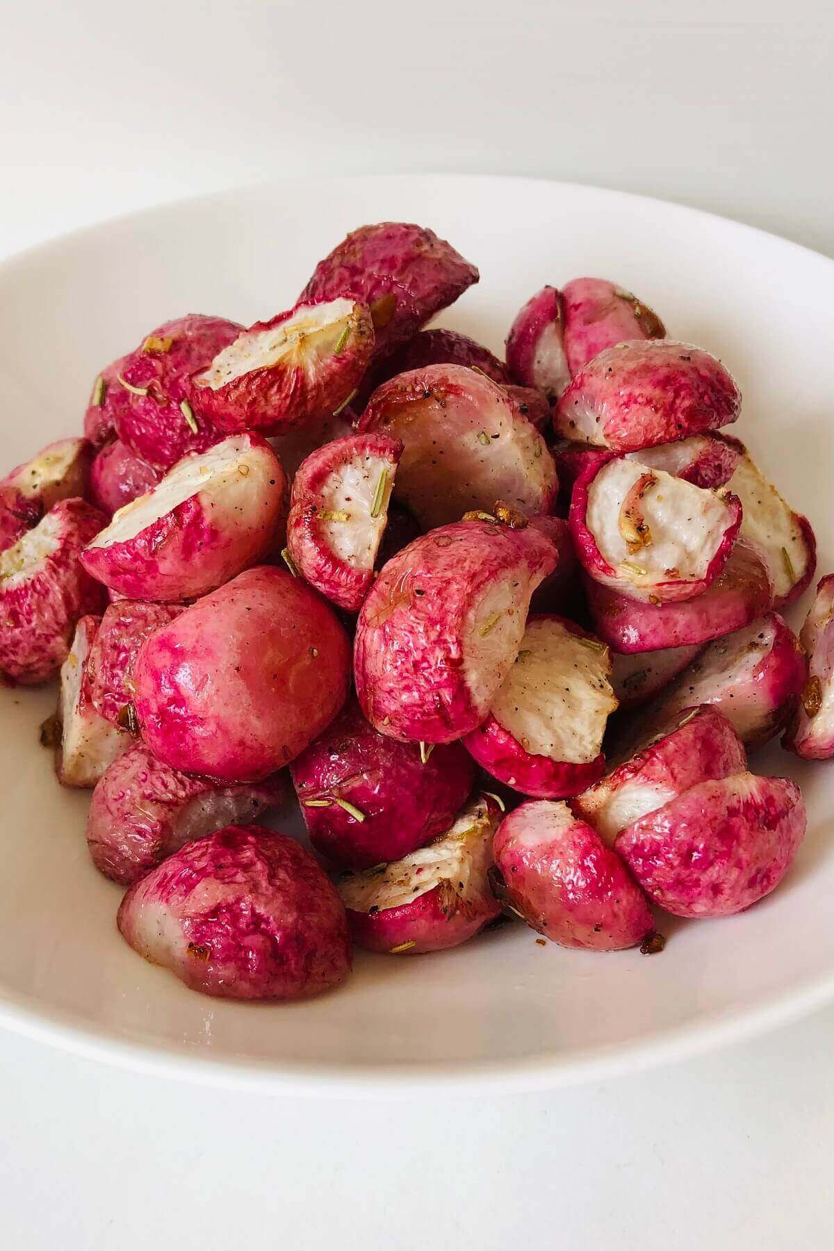 Cooked radishes in a bowl.