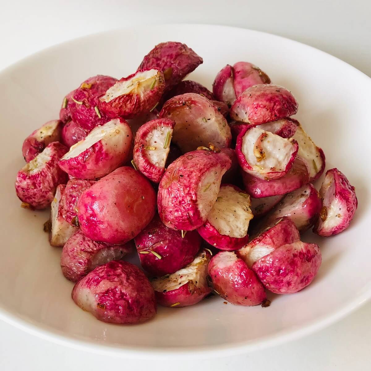 A bowl of cooked radishes.