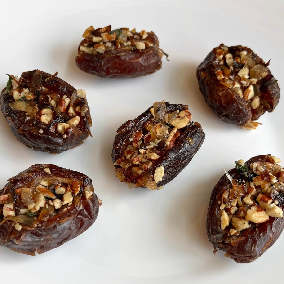 Dates stuffed with onions, sage, and toasted pecans.