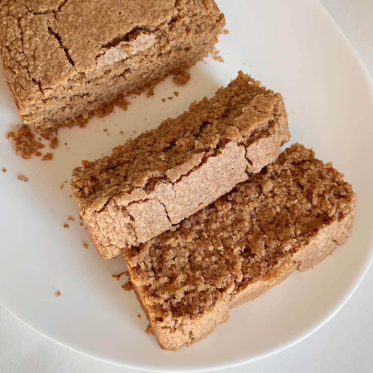 Thick slices of oat flour cake on a white plate.