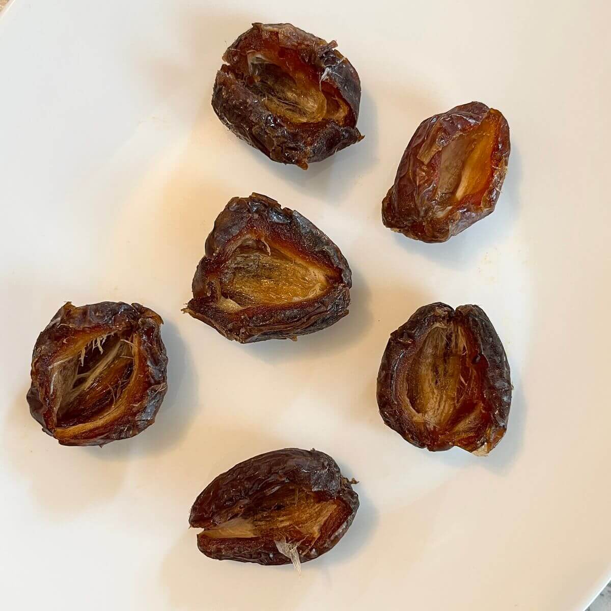 Pitted dates on a plate.