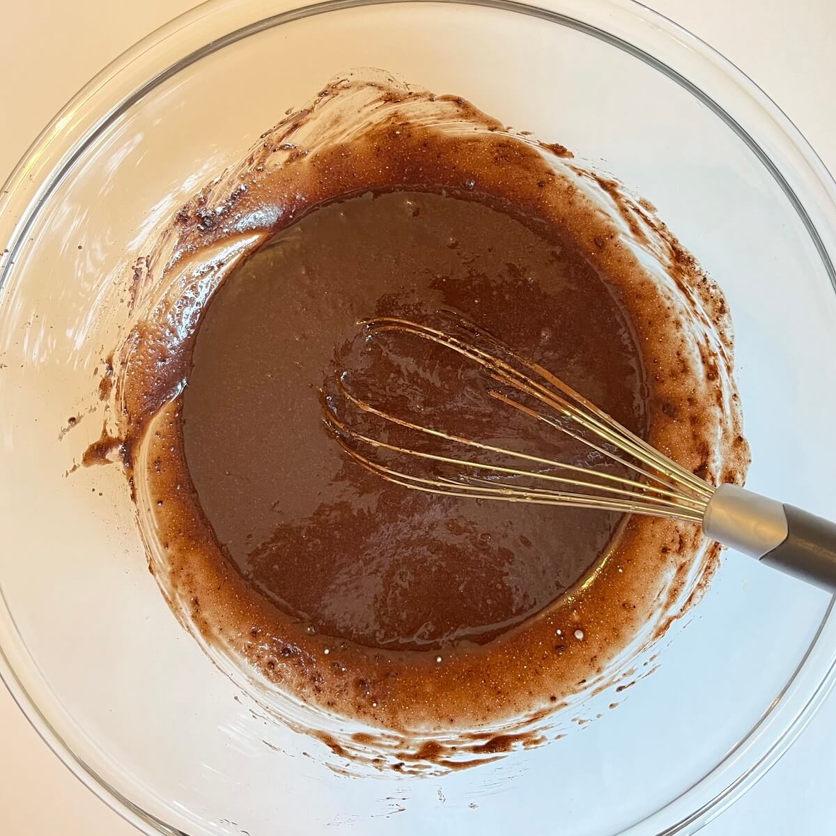 Vegan donut batter in a glass bowl.