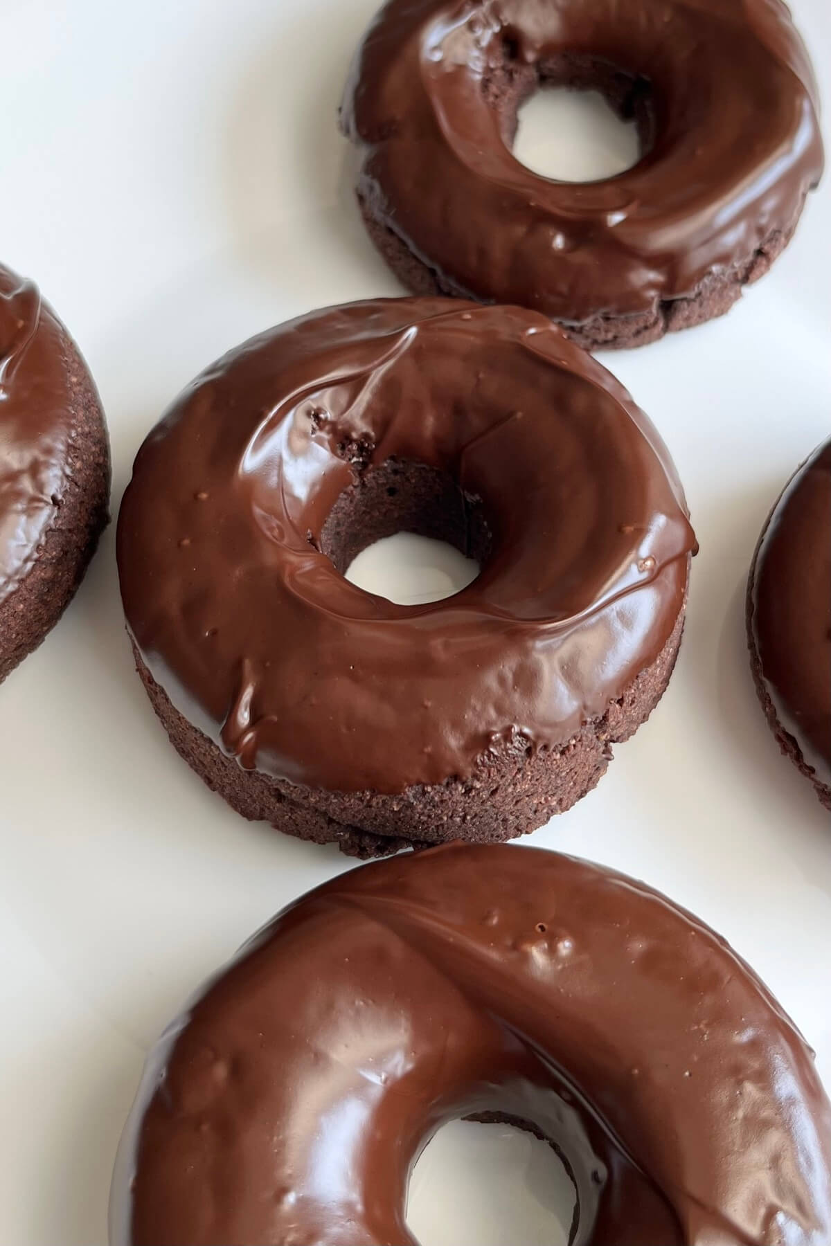 Paleo donuts on a white plate.