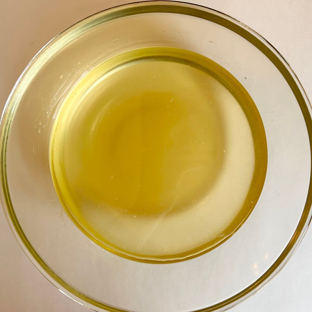 Wet ingredients for low-carb bread in a glass bowl.