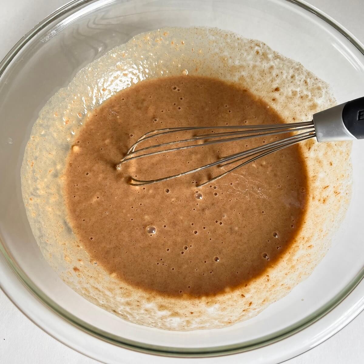 Wet ingredients for paleo banana bread in a glass bowl.