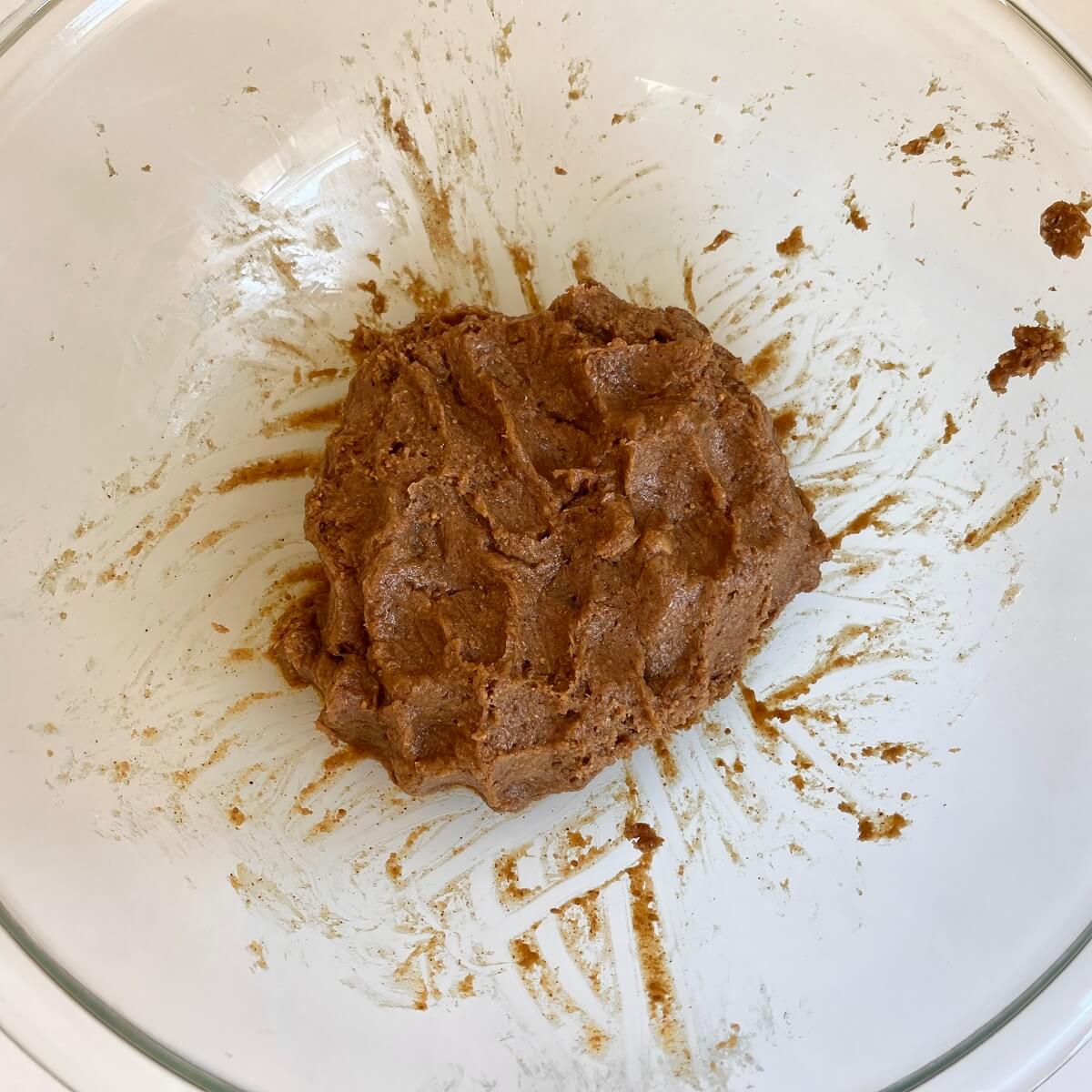 Fig dough in a glass mixing bowl.