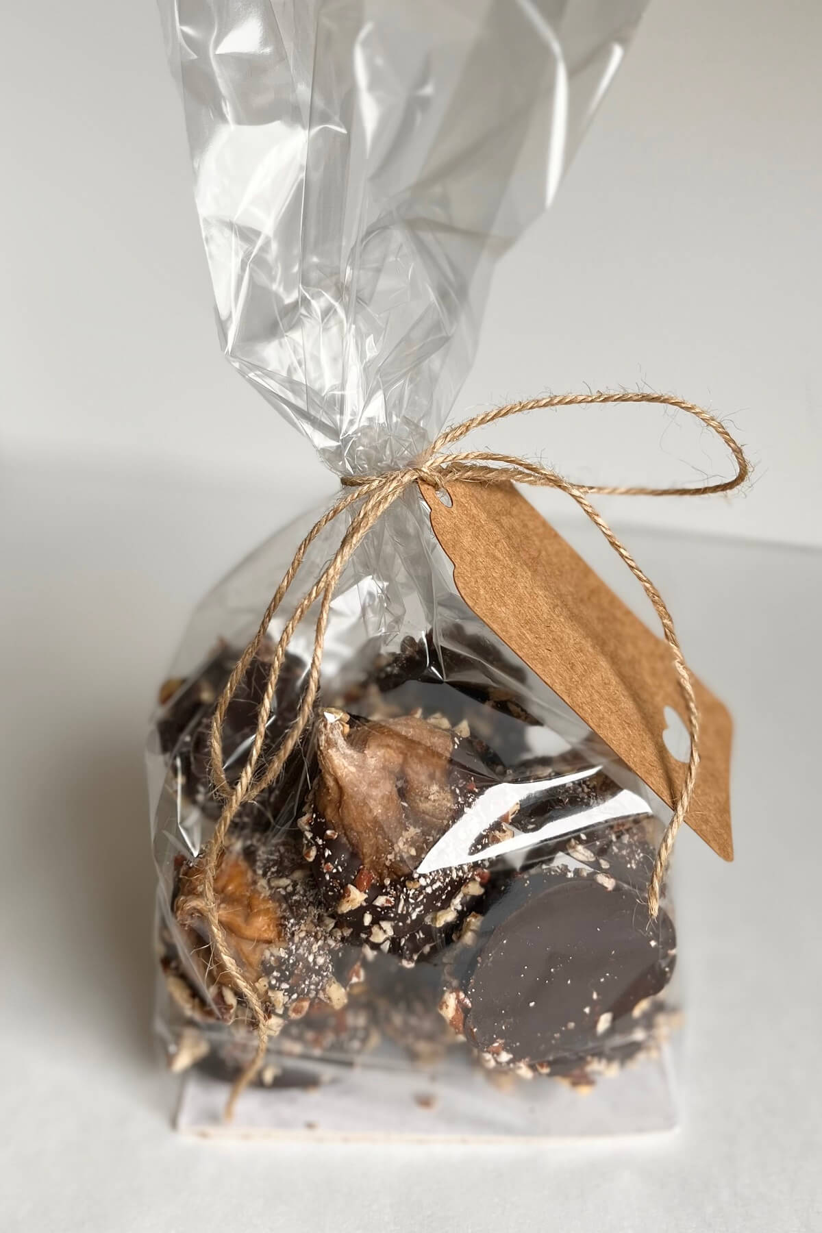Fig treats in a cellophane bag tied with twine.