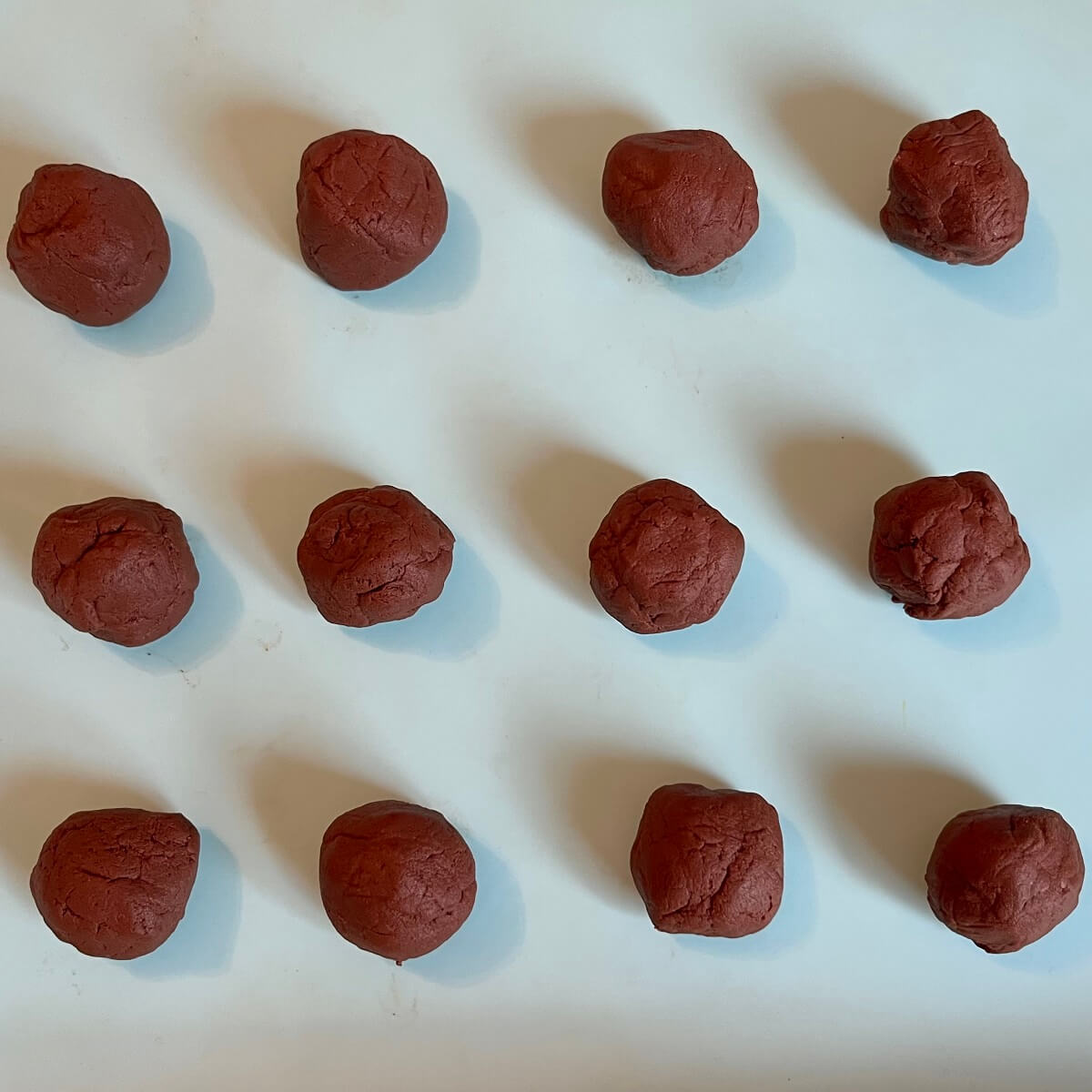 Truffle balls on a silicone baking mat.
