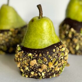 Chocolate coated pears crusted with chopped pistachios.