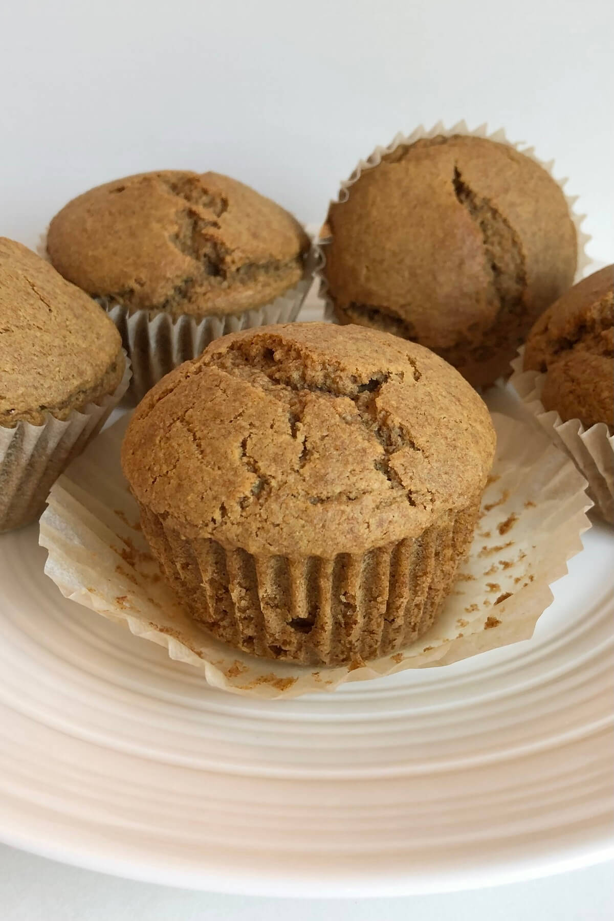 Muffins made with spelt on a white plate.