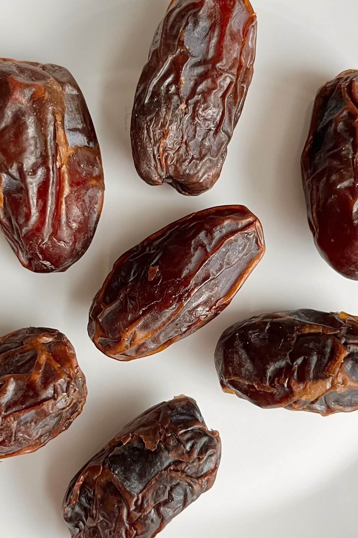 Dates on a white plate.