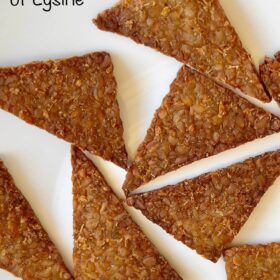 Triangles of crispy baked tempeh on a white plate.