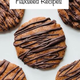 Chocolate drizzled cookies made with flaxseed on a white plate.