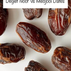 Medjool dates on a white plate.