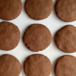 Carob cookies on a white platter.