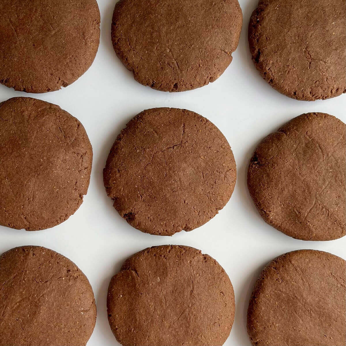 Carob cookies on a white plate.